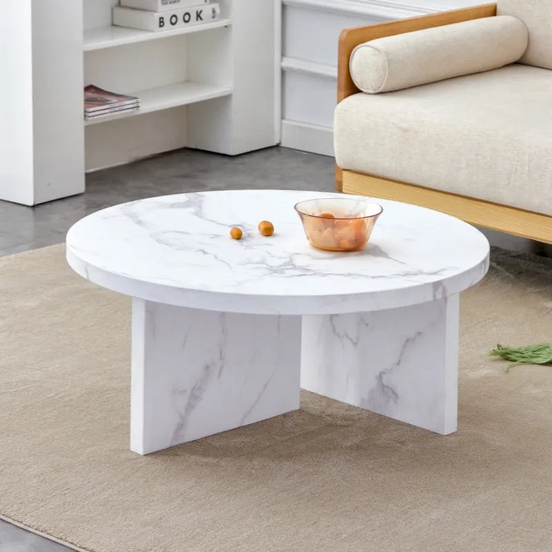 A white MDF material circular patterned coffee table suitable for small spaces and living rooms.