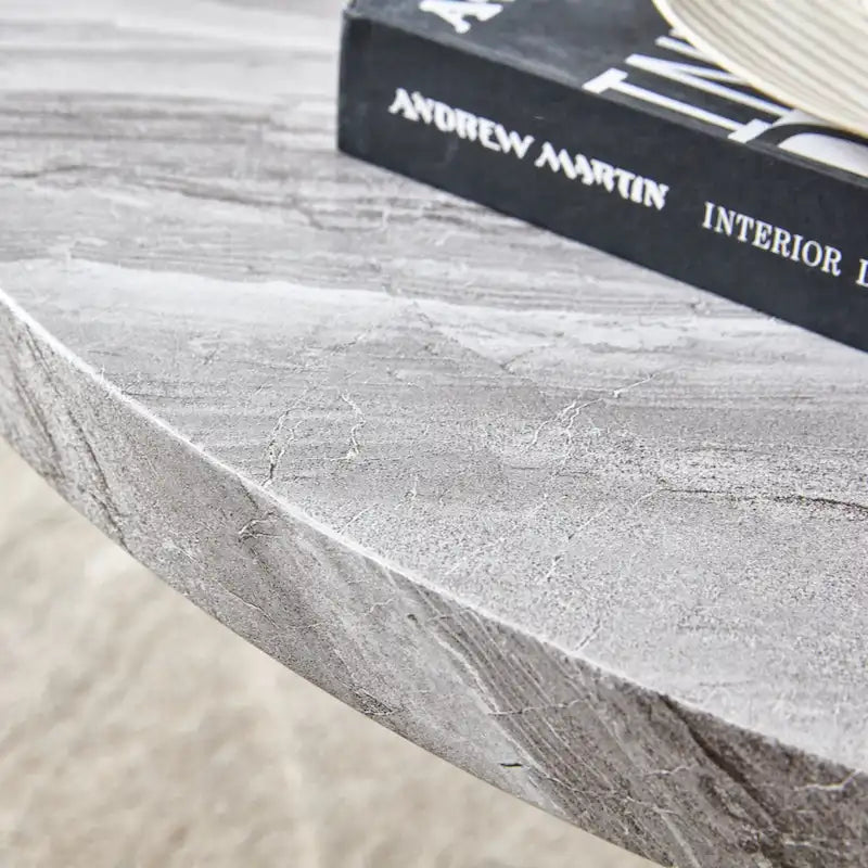 A white MDF material circular patterned coffee table suitable for small spaces and living rooms.